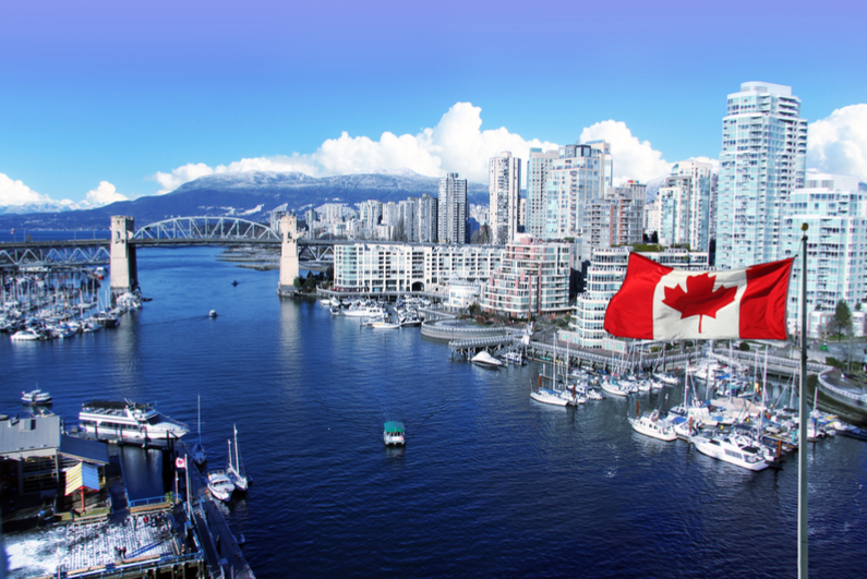 Canadian flag against Vancouver skyline