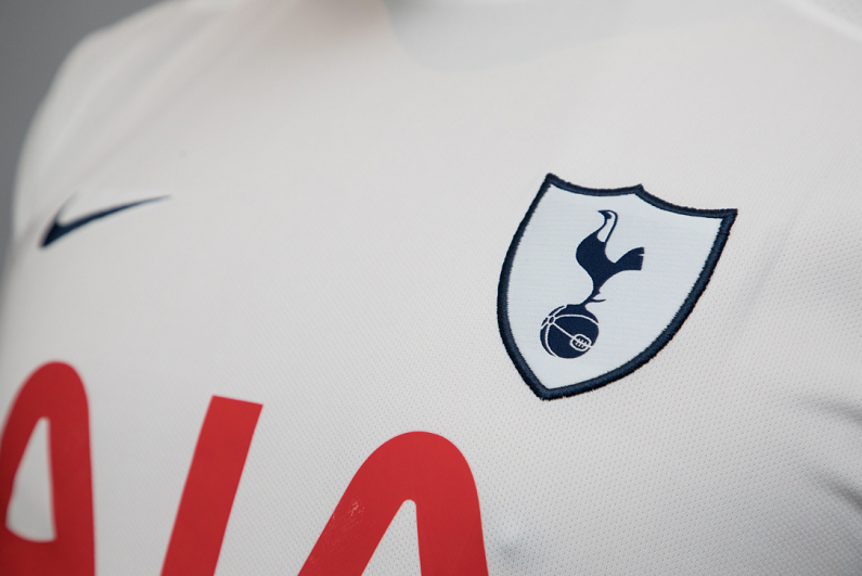 Logo of Tottenham Hotspur soccer club printed on jersey.