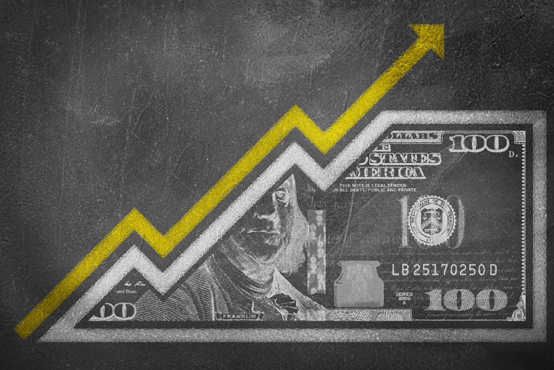 A money bill drawn on a chalk board looking like a growth graph.