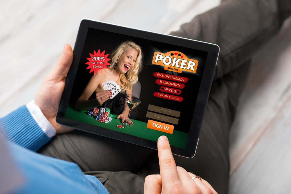 man viewing online poker promo on a tablet device