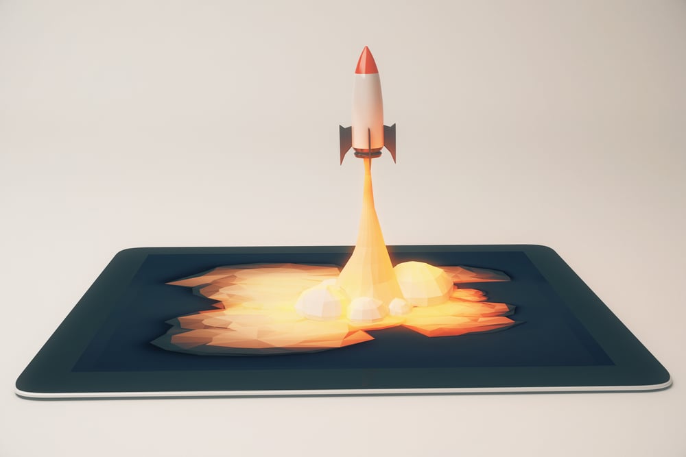 online launch concept shows rocket launching out of tablet device