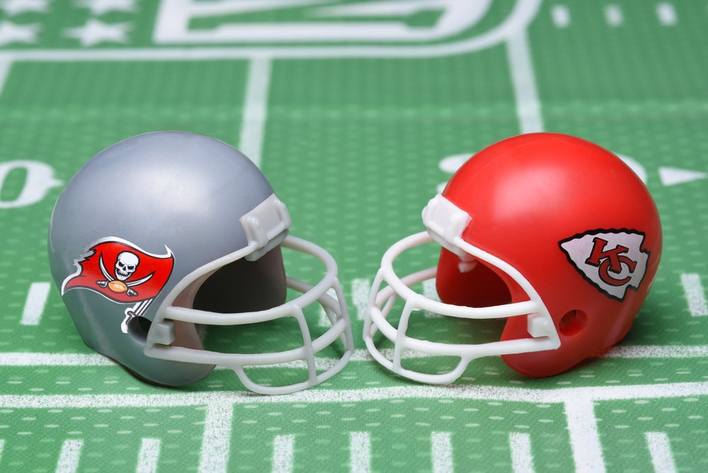 Tampa Bay Buccaneers and Kansas City Chiefs helmets on a pitch