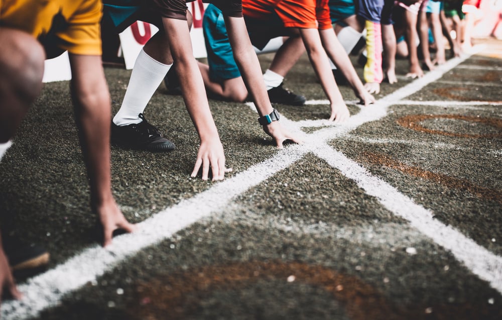 athletes lined up at the starting line of a race