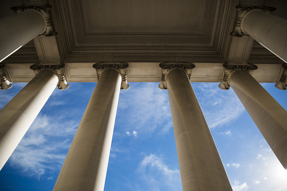 building columns against a blue sky backdrop